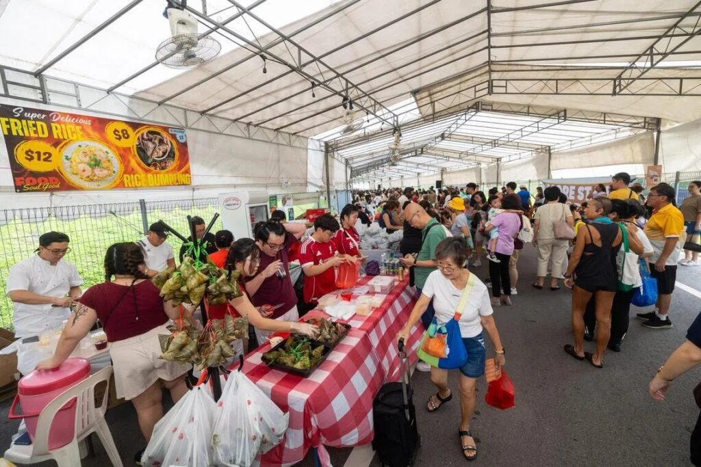 Businesses, church groups, schools and family-owned enterprises came together in support of Assisi Fun Day, setting up stalls at St. Joseph's Institution International School to raise funds for Assisi Hospice. Photo by Lianhe Zaobao.